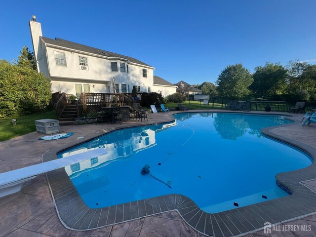 view of pool featuring a wooden deck