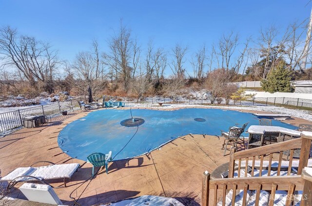 view of snow covered pool