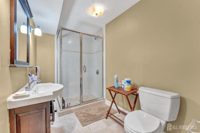 bathroom featuring walk in shower, tile patterned floors, vanity, and toilet