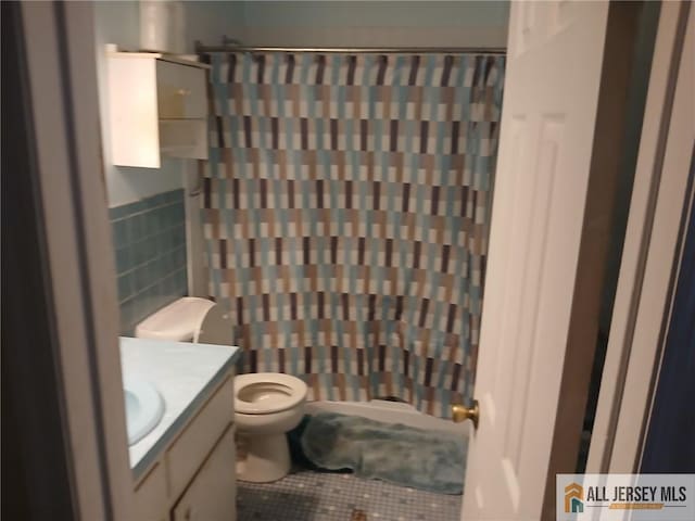 148 Dutton St, Franklin, NJ 08873 - bathroom featuring tile walls, vanity, tile patterned flooring, and a shower with curtain