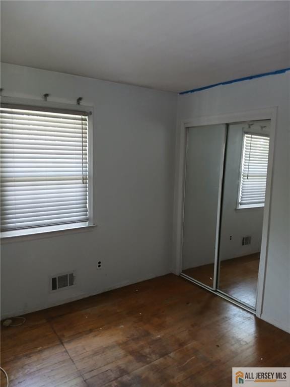 148 Dutton St, Franklin, NJ 08873 - unfurnished bedroom with wood finished floors and a closet