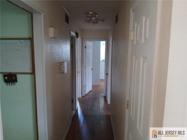 148 Dutton St, Franklin, NJ 08873 - hallway featuring dark wood finished floors