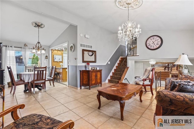 7 Piedmont Dr, Old Bridge, NJ 08857 - living room with a chandelier, light tile patterned floors, stairway, and high vaulted ceiling