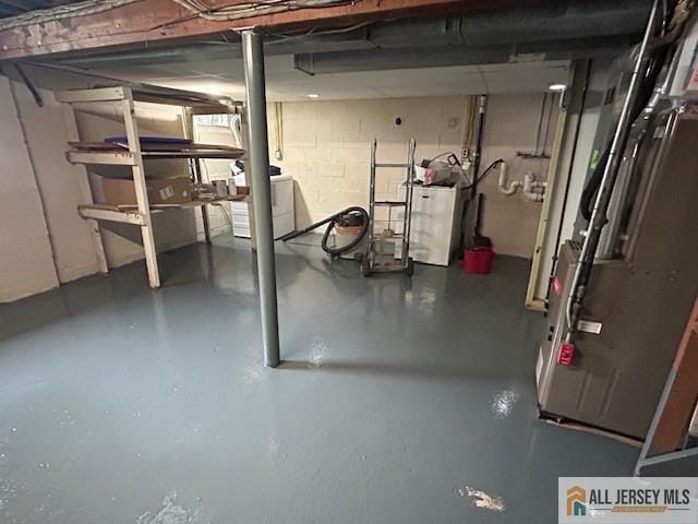 7 Piedmont Dr, Old Bridge, NJ 08857 - unfinished basement featuring washer / clothes dryer, heating unit, and concrete block wall