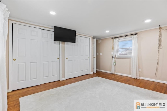 7 Piedmont Dr, Old Bridge, NJ 08857 - unfurnished bedroom featuring two closets, wood finished floors, and recessed lighting