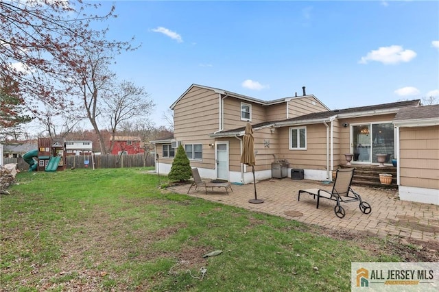 7 Piedmont Dr, Old Bridge, NJ 08857 - back of property featuring a playground and a patio