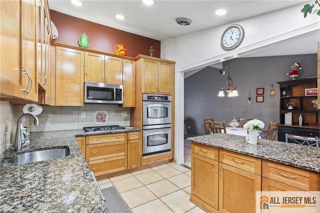 7 Piedmont Dr, Old Bridge, NJ 08857 - kitchen with stainless steel appliances, decorative backsplash, dark stone counters, light tile patterned floors, and pendant lighting