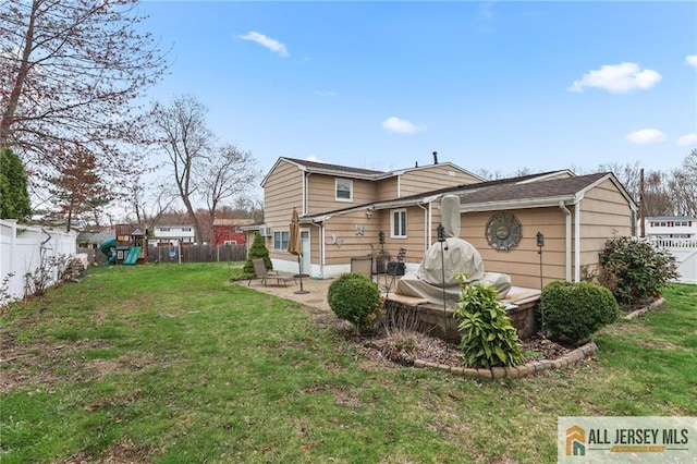 7 Piedmont Dr, Old Bridge, NJ 08857 - rear view of house featuring a playground and a patio area