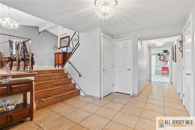 7 Piedmont Dr, Old Bridge, NJ 08857 - foyer entrance with a chandelier, light tile patterned flooring, and stairway