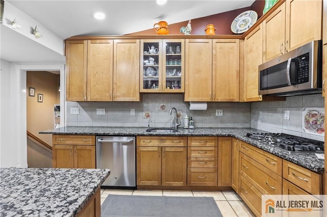 7 Piedmont Dr, Old Bridge, NJ 08857 - kitchen with appliances with stainless steel finishes, tasteful backsplash, dark stone counters, glass insert cabinets, and recessed lighting