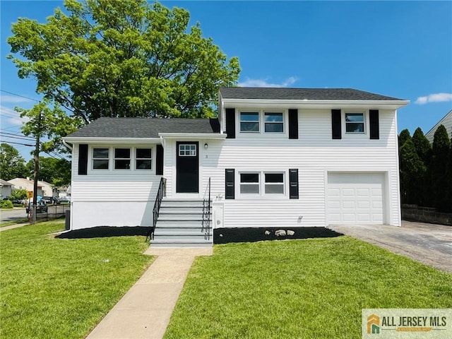 3 Tracy Dr, Fords, NJ 08863 - tri-level home featuring concrete driveway, an attached garage, and a front lawn