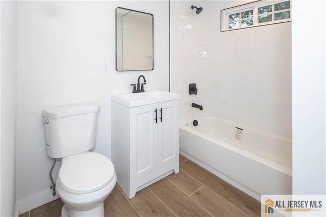 full bathroom with toilet, vanity, wood finished floors, and bathtub / shower combination