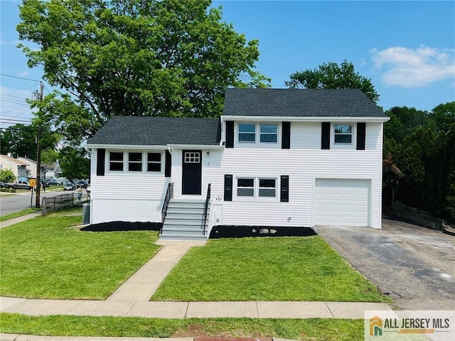 3 Tracy Dr, Fords, NJ 08863 - split level home with asphalt driveway, an attached garage, and roof with shingles