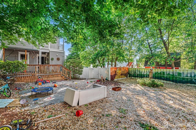55 Suydam St, New Brunswick, NJ 08901 - fenced yard with an outdoor fire pit, a gate, and a balcony