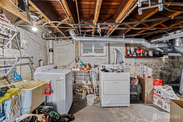 55 Suydam St, New Brunswick, NJ 08901 - unfinished basement featuring separate washer and dryer