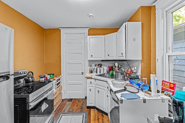55 Suydam St, New Brunswick, NJ 08901 - kitchen with stainless steel appliances, dark wood-type flooring, white cabinetry, and light countertops