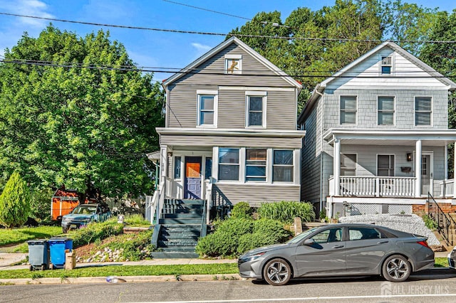 55 Suydam St, New Brunswick, NJ 08901 - view of front facade featuring covered porch