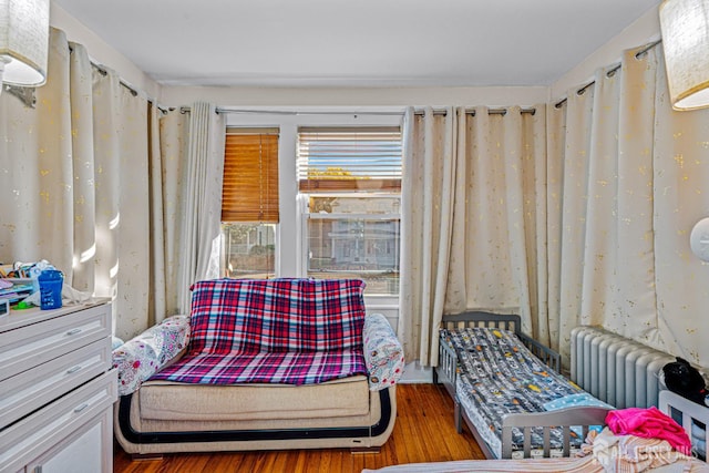 55 Suydam St, New Brunswick, NJ 08901 - sitting room with wood finished floors and radiator heating unit