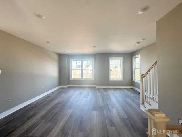 363 Ferris St, South Amboy, NJ 08879 - unfurnished living room with stairway, dark wood-type flooring, and baseboards