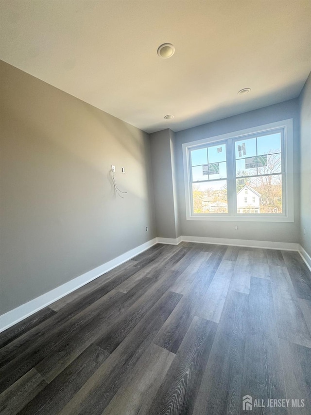 363 Ferris St, South Amboy, NJ 08879 - unfurnished room featuring baseboards and dark wood finished floors