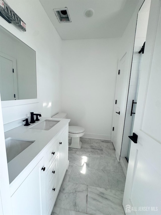 363 Ferris St, South Amboy, NJ 08879 - full bath with toilet, marble finish floor, a sink, double vanity, and baseboards