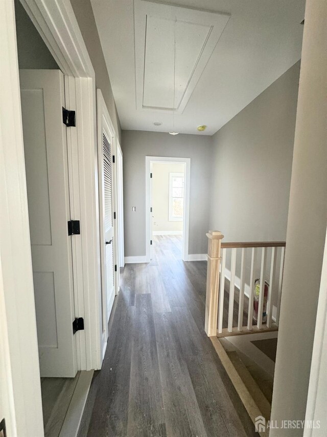 363 Ferris St, South Amboy, NJ 08879 - hall with attic access, baseboards, dark wood finished floors, and an upstairs landing