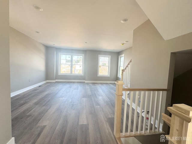 363 Ferris St, South Amboy, NJ 08879 - unfurnished living room featuring stairs, baseboards, and wood finished floors