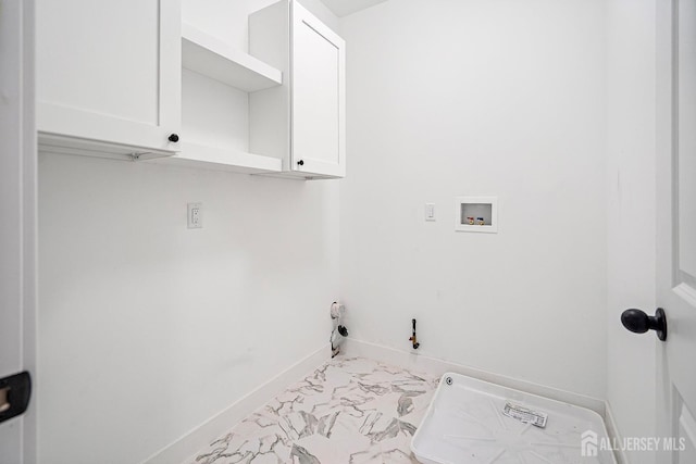 laundry area featuring cabinets, hookup for a washing machine, and hookup for a gas dryer