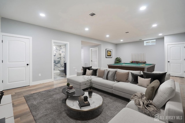 living room featuring hardwood / wood-style floors and pool table