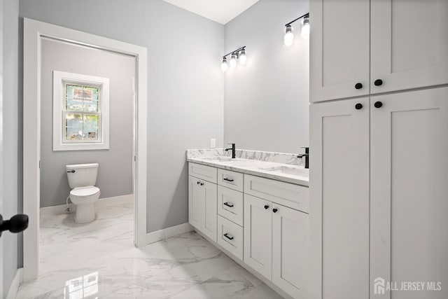 bathroom with vanity and toilet