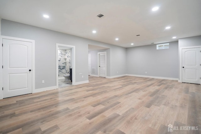 basement featuring light wood-type flooring