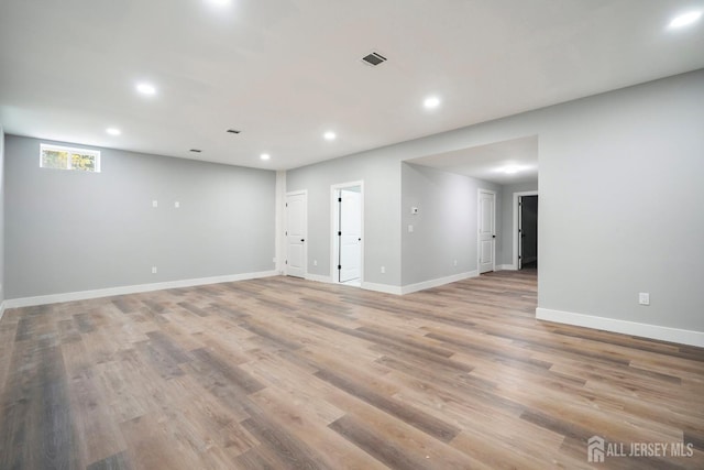 unfurnished room with light hardwood / wood-style floors