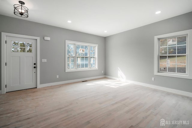 entrance foyer with light hardwood / wood-style floors