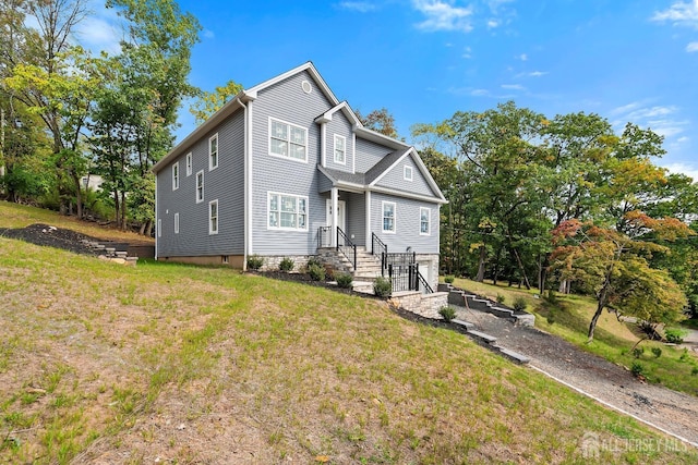 view of front of property with a front lawn