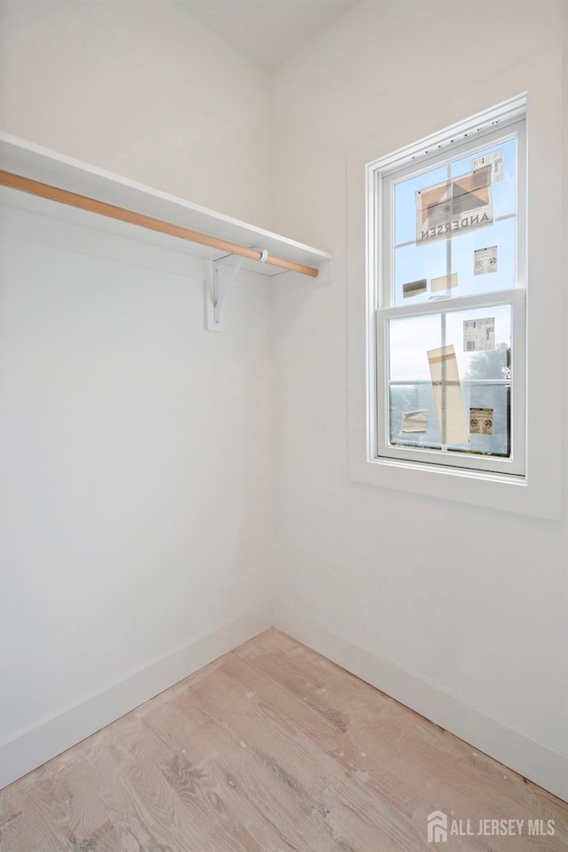 walk in closet featuring light wood-type flooring