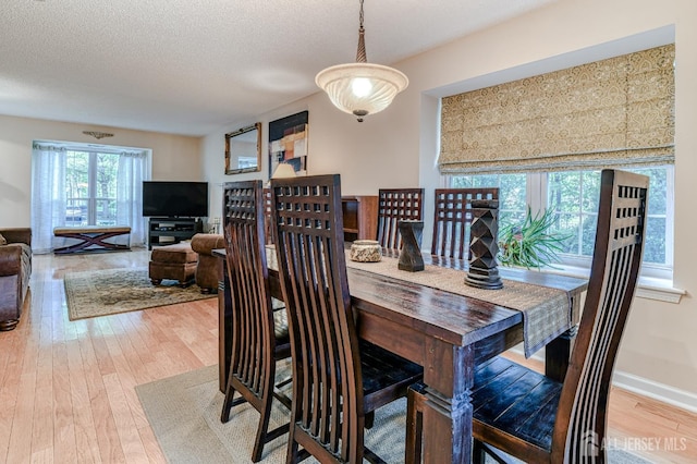 25 Sheffield Ct, North Brunswick, NJ 08902 - dining space featuring hardwood / wood-style flooring and a textured ceiling