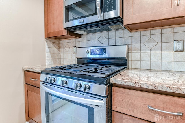 25 Sheffield Ct, North Brunswick, NJ 08902 - kitchen with stainless steel appliances and tasteful backsplash