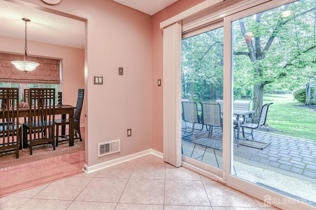 25 Sheffield Ct, North Brunswick, NJ 08902 - doorway featuring baseboards and light tile patterned floors