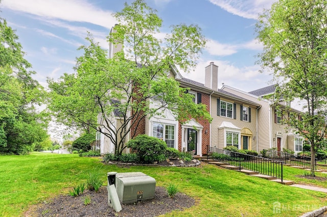 25 Sheffield Ct, North Brunswick, NJ 08902 - view of front of home featuring a chimney