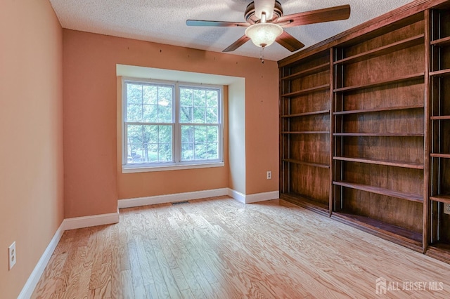 25 Sheffield Ct, North Brunswick, NJ 08902 - spare room featuring a textured ceiling, wood finished floors, and ceiling fan
