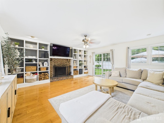 218 Washington Ave, Matawan, NJ 07747 - living room featuring ceiling fan, light wood-style floors, and a fireplace