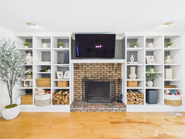 218 Washington Ave, Matawan, NJ 07747 - unfurnished living room featuring wood finished floors and a fireplace