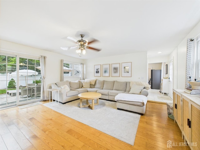 218 Washington Ave, Matawan, NJ 07747 - living room with light wood-style floors and ceiling fan