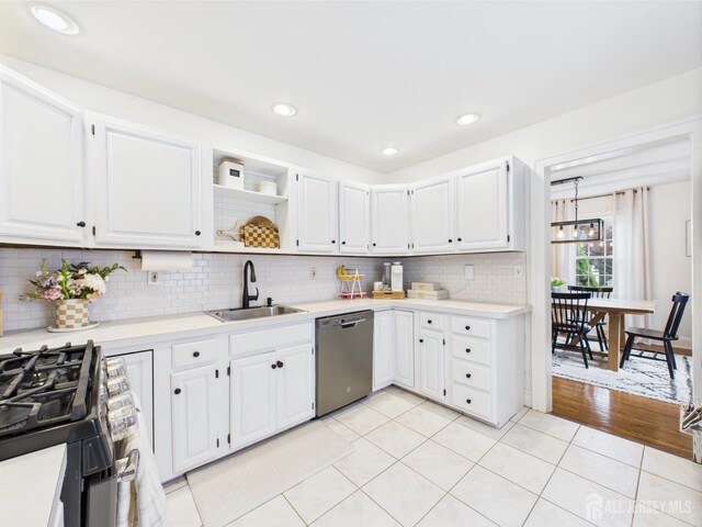 218 Washington Ave, Matawan, NJ 07747 - kitchen with stainless steel dishwasher, a sink, gas range, light countertops, and recessed lighting