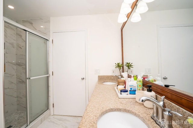 bathroom with vanity and an enclosed shower