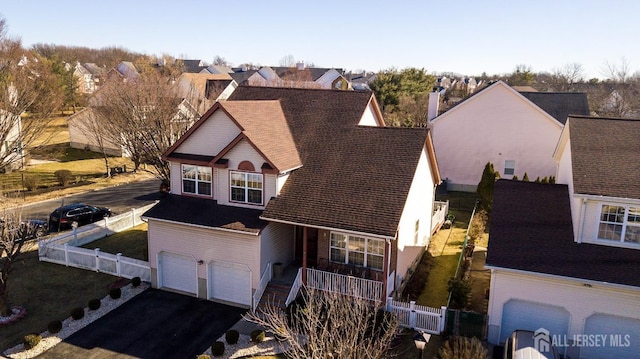 exterior space with a garage and covered porch