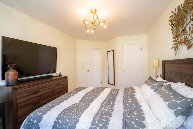 bedroom featuring a chandelier