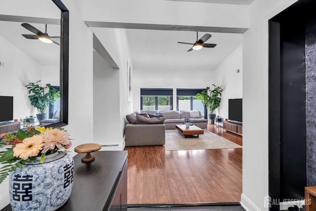218 Community Cir, Old Bridge, NJ 08857 - living room featuring ceiling fan, lofted ceiling, wood finished floors, and a baseboard radiator