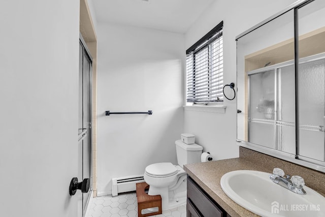 218 Community Cir, Old Bridge, NJ 08857 - full bath with a baseboard radiator, a shower with door, toilet, and vanity