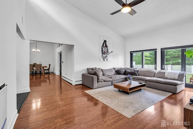 218 Community Cir, Old Bridge, NJ 08857 - living area with high vaulted ceiling, ceiling fan, wood finished floors, a chandelier, and a baseboard heating unit